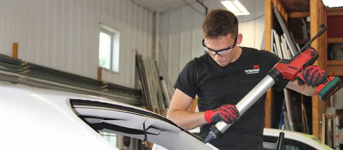 Maximum Auto Glass Repair technician repairing a windshield